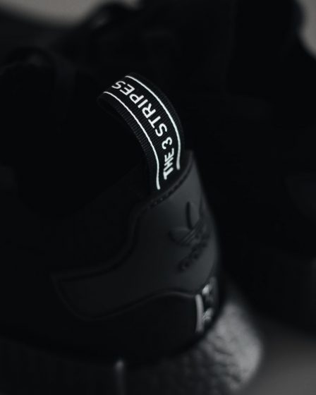 selective focus photography of Adidas NMD shoe