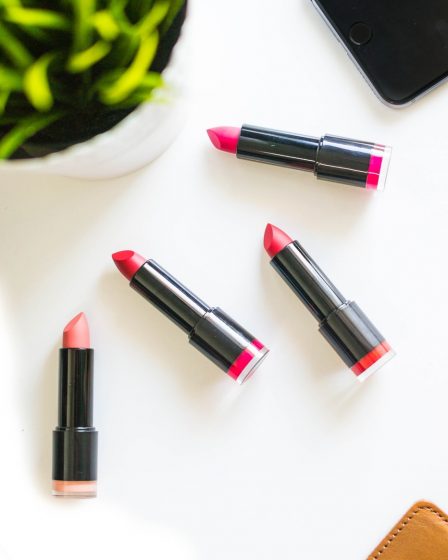four assorted-color lipsticks