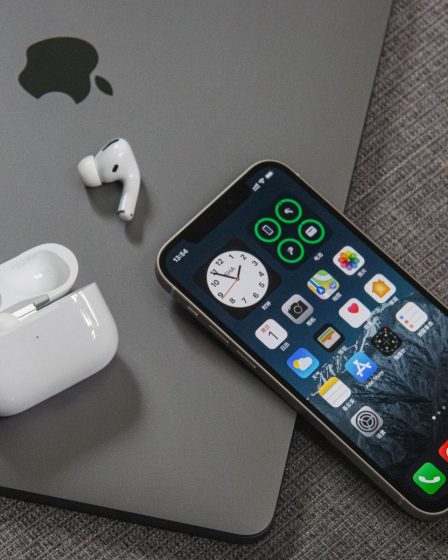 space gray iphone 6 beside apple earpods