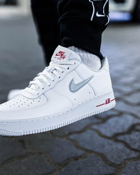 person wearing white nike air force 1