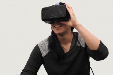 woman wearing black VR goggles