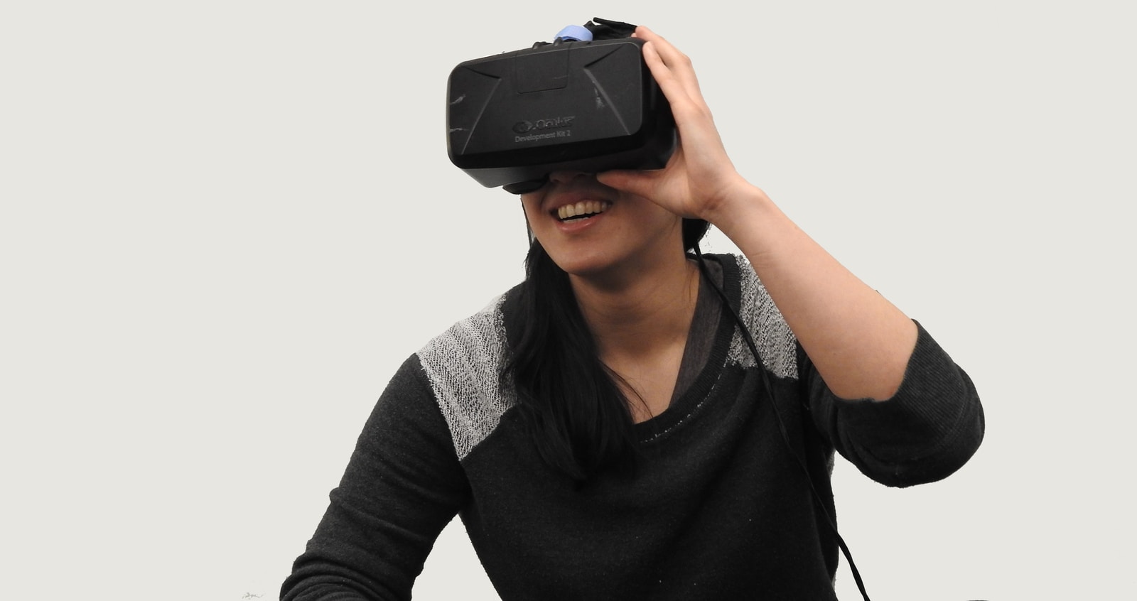 woman wearing black VR goggles