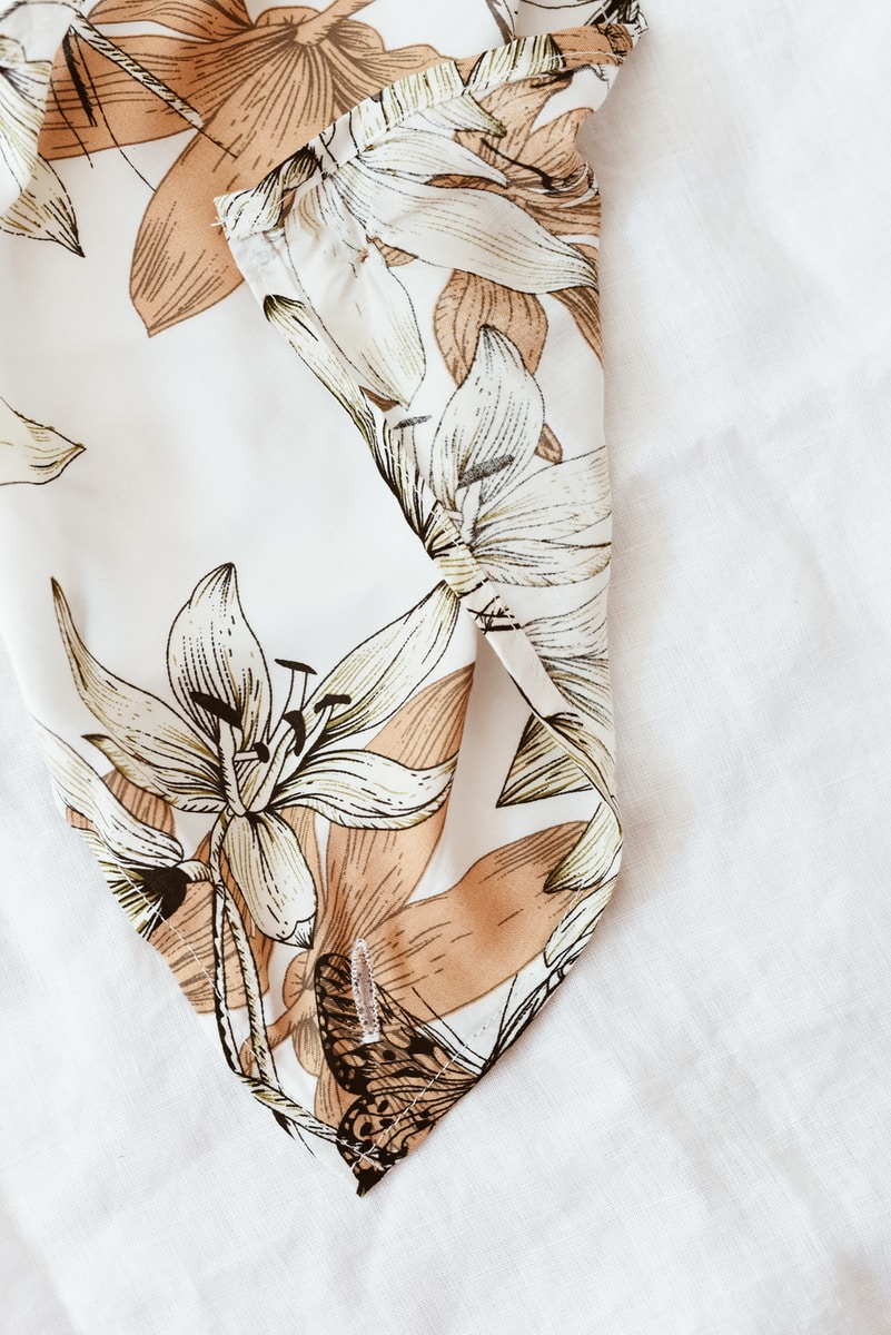 white and brown floral textile