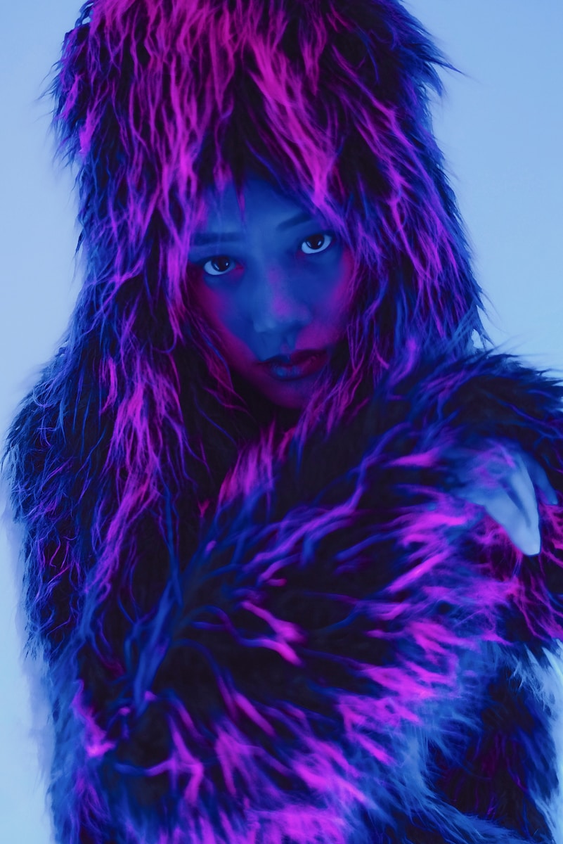 woman in purple and blue fur coat