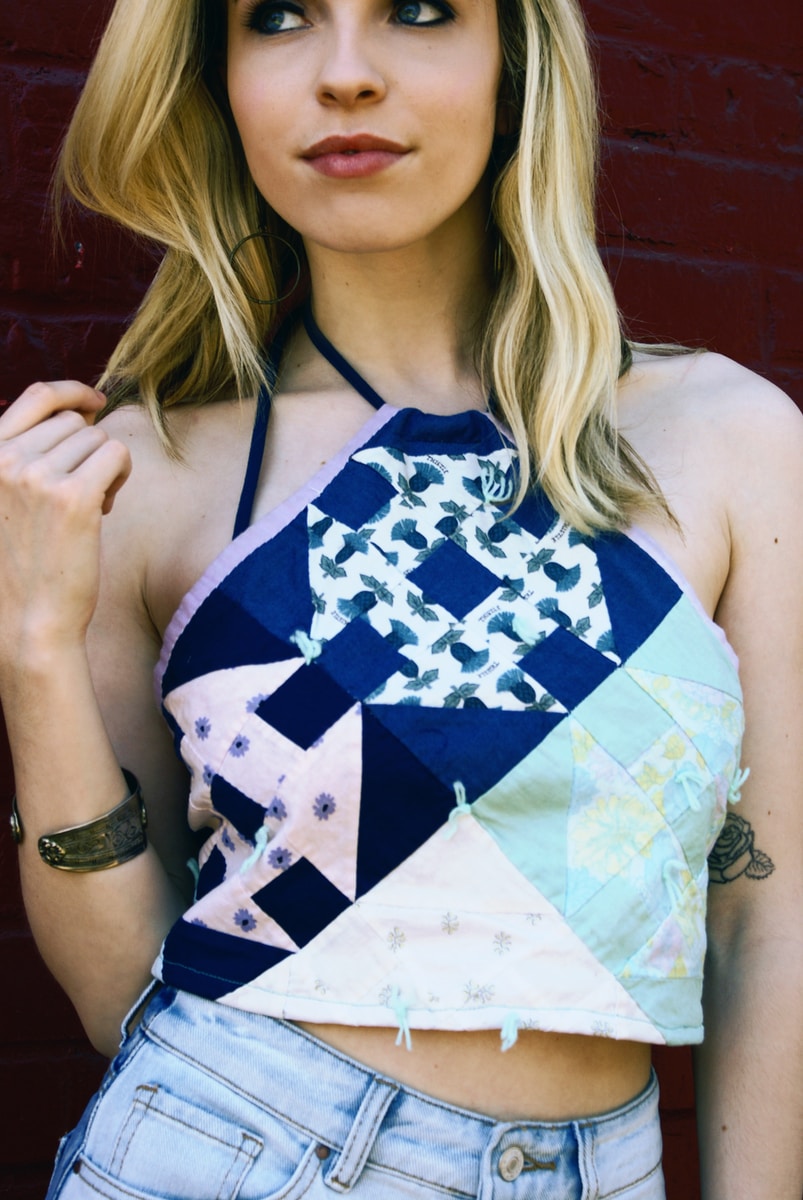 woman in blue and white floral spaghetti strap top