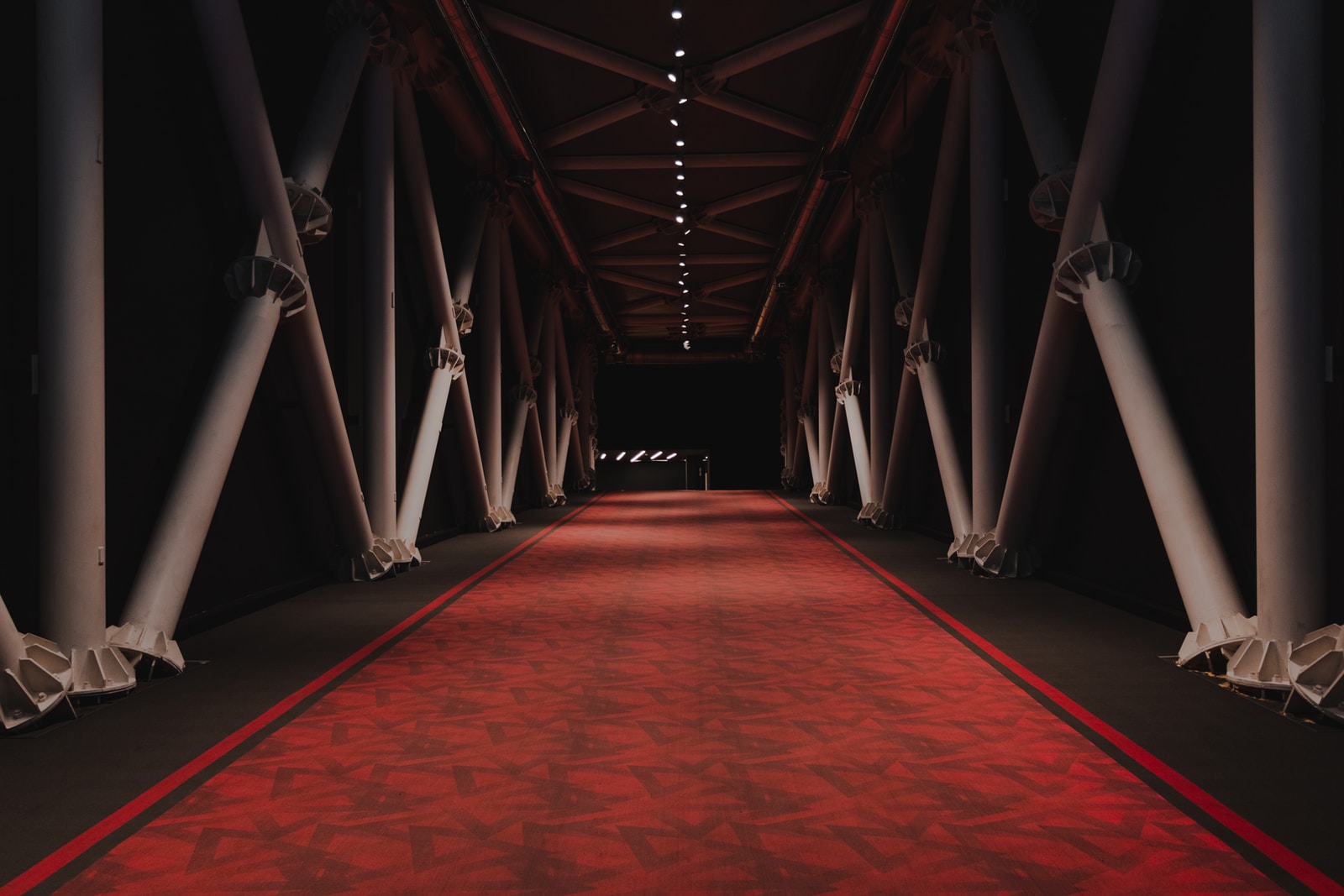 red and brown hallway with white lights