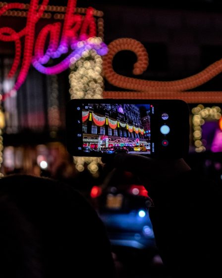 smartphone viewing assorted-color lights