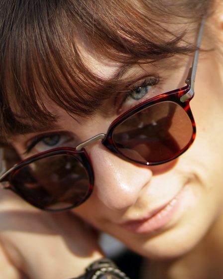 women's black and red tortoiseshell-framed sunglasses