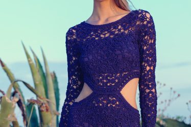 woman in purple lace knitted long-sleeved dress during daytime