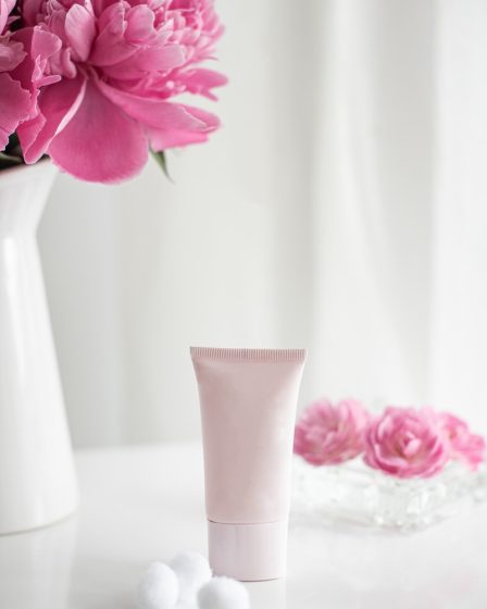 pink flower in white ceramic vase