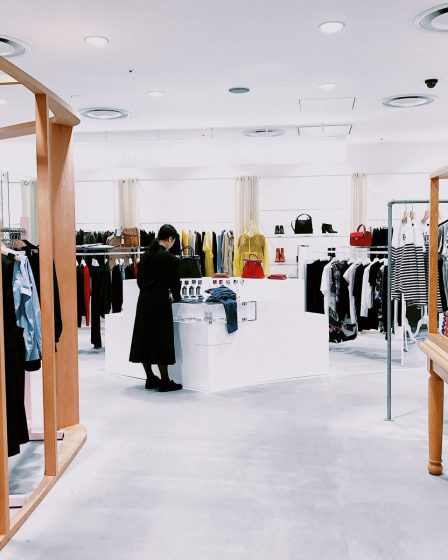 woman standing inside clothing area