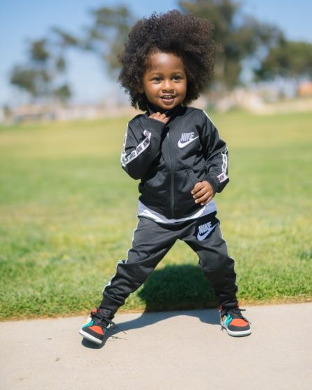 boy wearing black Nike track suit